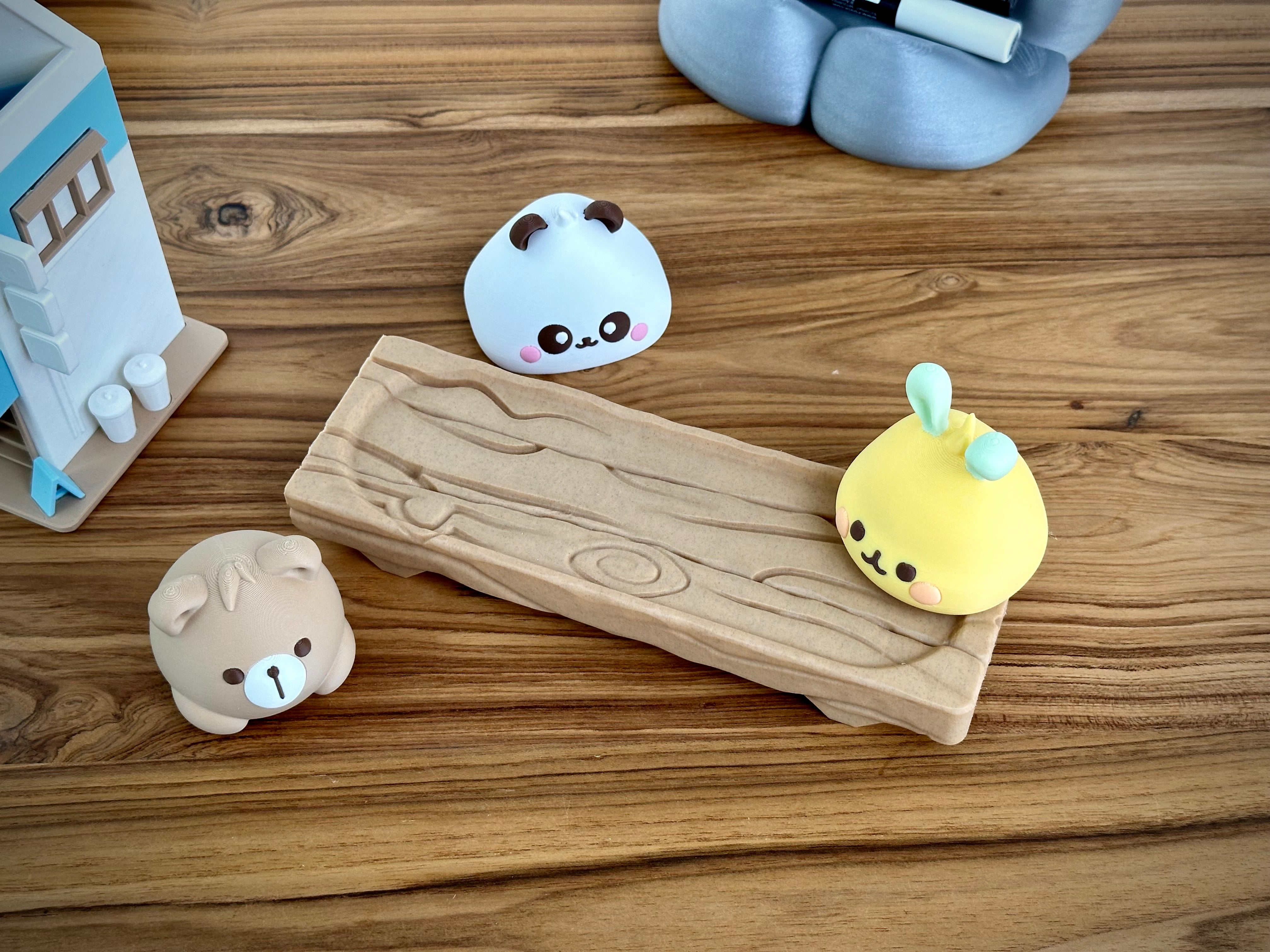 Mignons Baoers d'animaux Kawaii sur bloc de bois