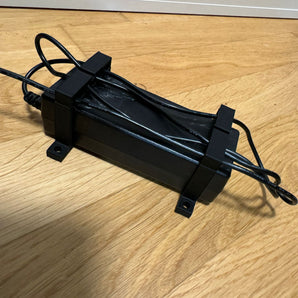 Support d'adaptateur secteur paramétrique avec serre-câble