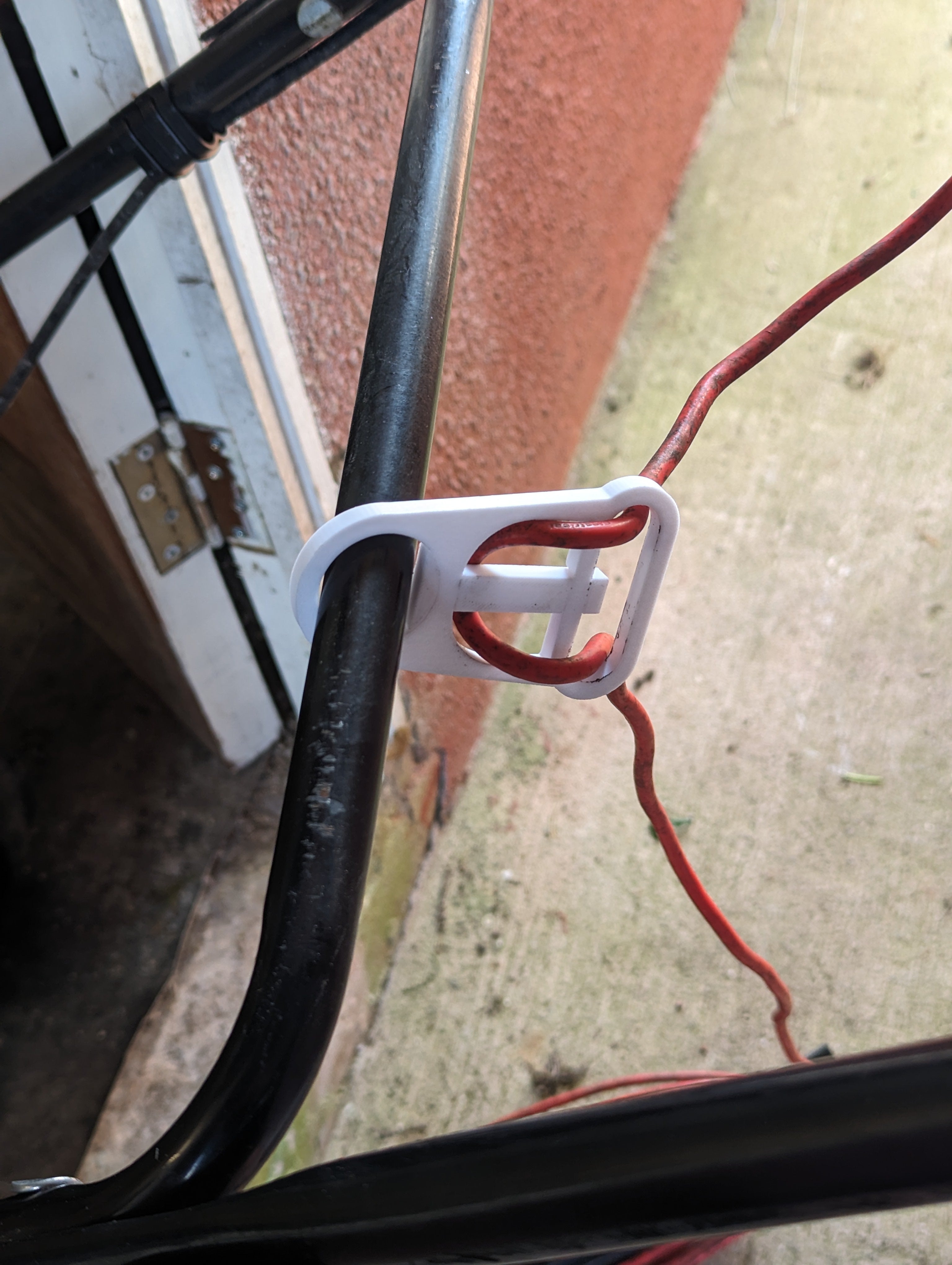 Support de câble pour tondeuse à gazon électrique