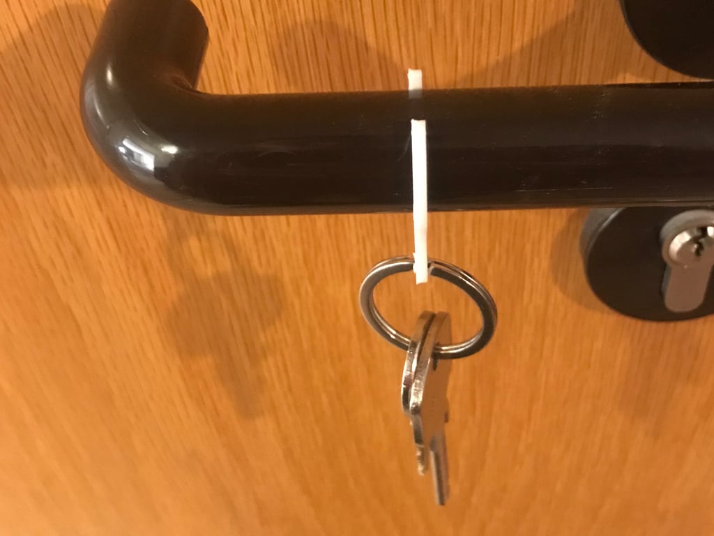 Porte-clés et jeton de caddie pour poignée de porte
