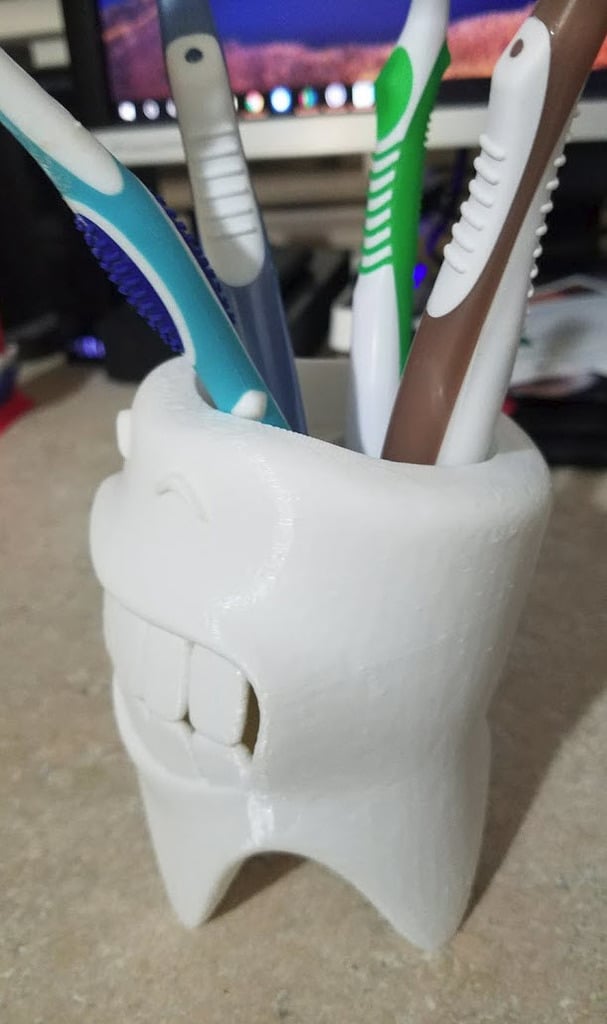 Porte-brosse à dents souriant avec système de drainage