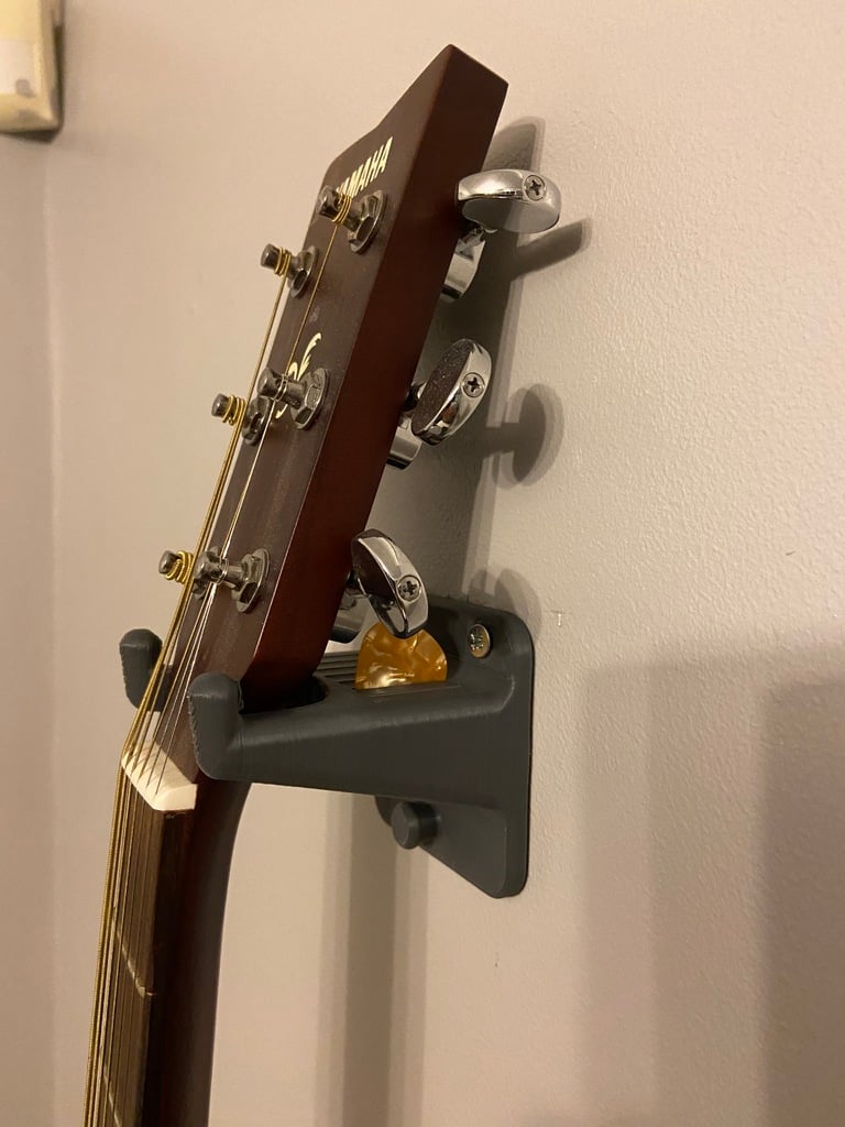 Support mural pour guitare avec espace pour médiators et sangle