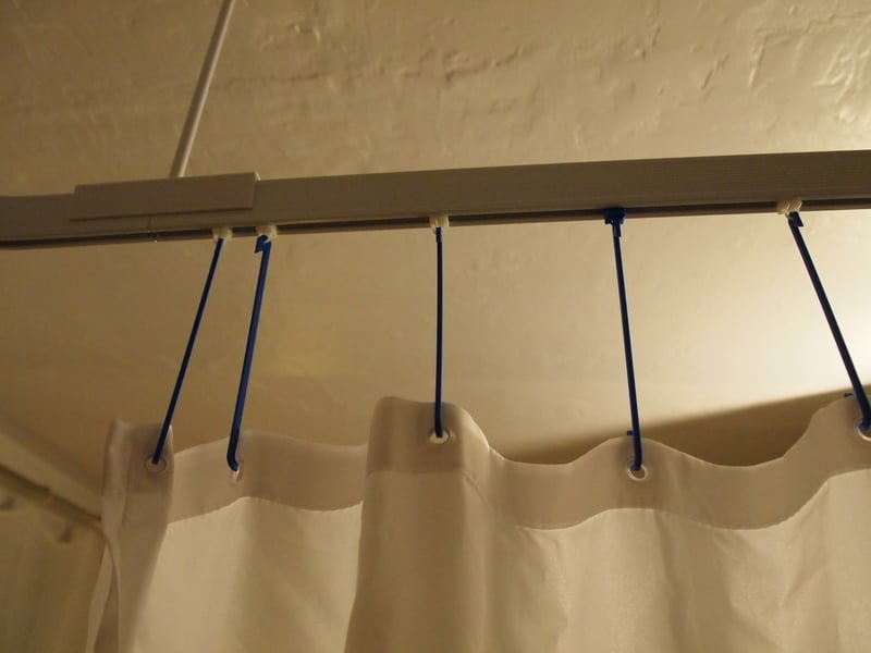 Crochet de longueur réglable pour rideau de douche